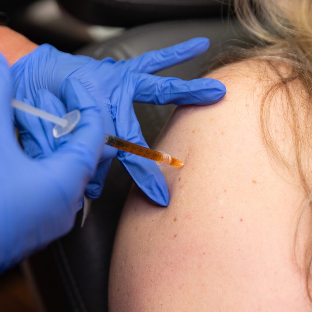 Medical injection administered into patient arm